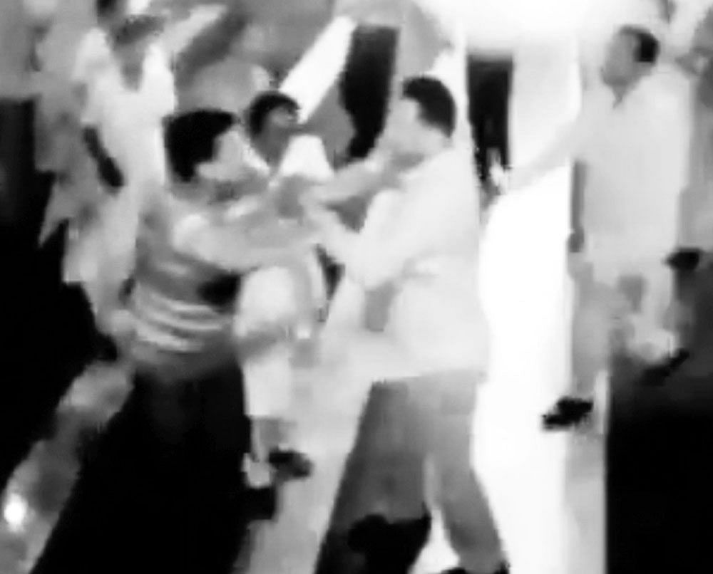 A video grab shows MP Ananthkumar Hegde (circled) assaulting a doctor at Sirsi in Uttara Kannada district on  Monday. dh photo