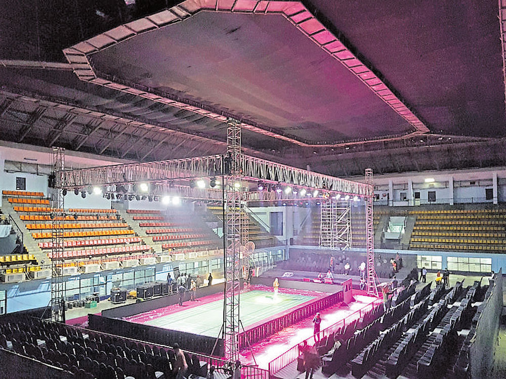 Organisers are burning the midnight oil to get the Koramangala Indoor Stadium ready in time for the Bengaluru leg of PBL starting Saturday. DH photo/ Arjun Ganesh