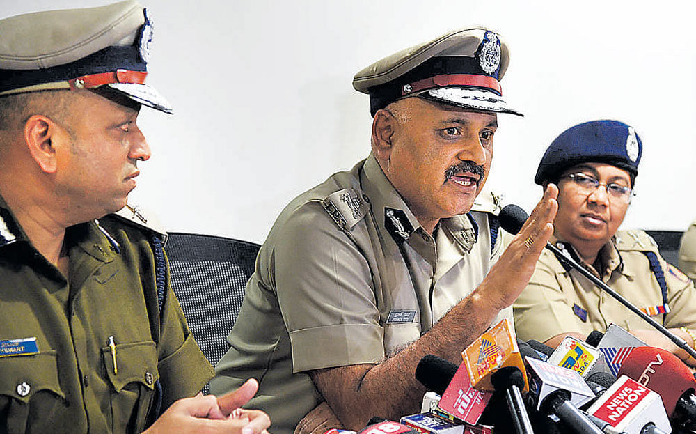 Police Commissioner Praveen Sood speaks at a media conference on Thursday. Additional Commissioners of Police  Hemant Nimbalkar and Malini Krishnamoorthy look on.