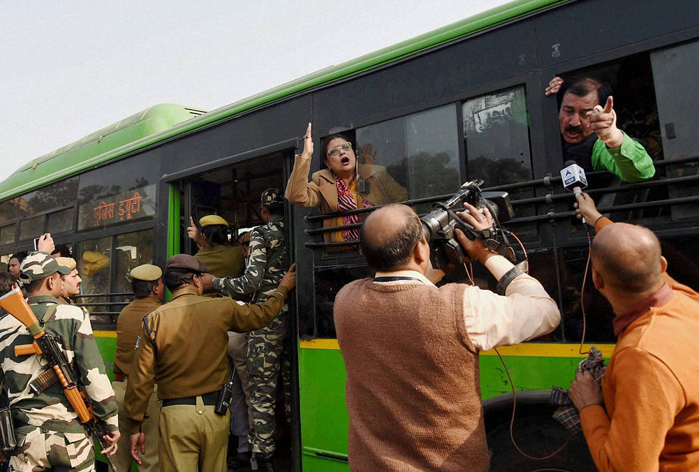 Police take away Trinamool Congress (TMC) MPs in a bus after they were arrested during a protest against arrest of their leader in Lok Sabha, Sudip Bandyopadhyay, near the Prime Minister's Office in New Delhi on Thursday. PTI Photo