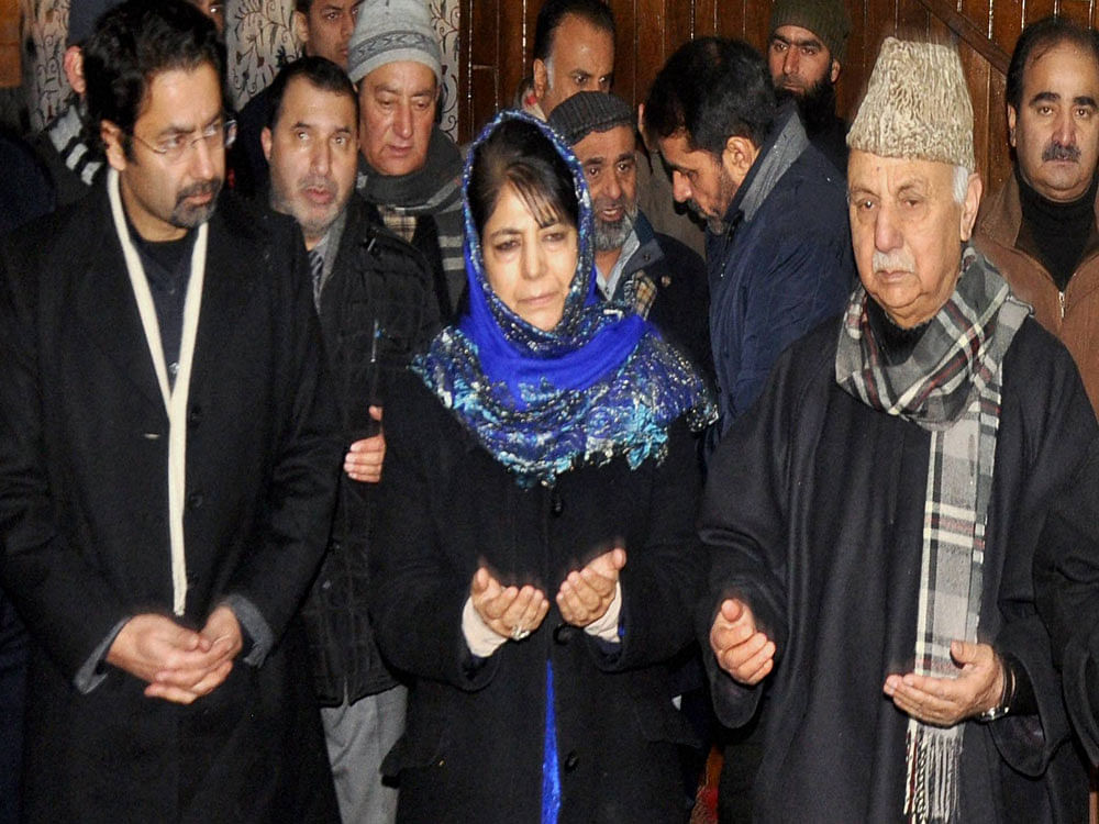 Chief Minister of Jammu and Kashmir Mehbooba Mufti, along with her brother Tasaduq Mufti (L), with party workers pay tribute to their father and former Chief Minister Mufti Mohammad Syed on his first death anniversary, in Srinagar on Saturday. PTI Photo