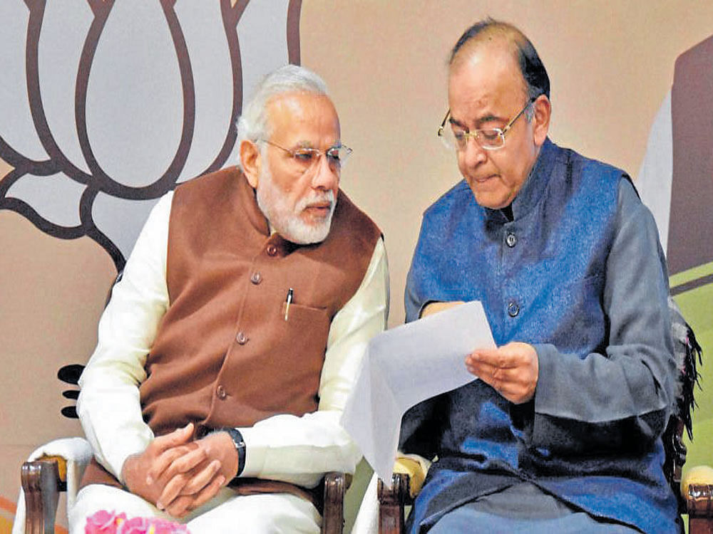 Prime Minister Narendra Modi (left) has a word with Finance Minister Arun Jaitley on the second day of the BJP's national executive meeting in New Delhi on Saturday. PTI