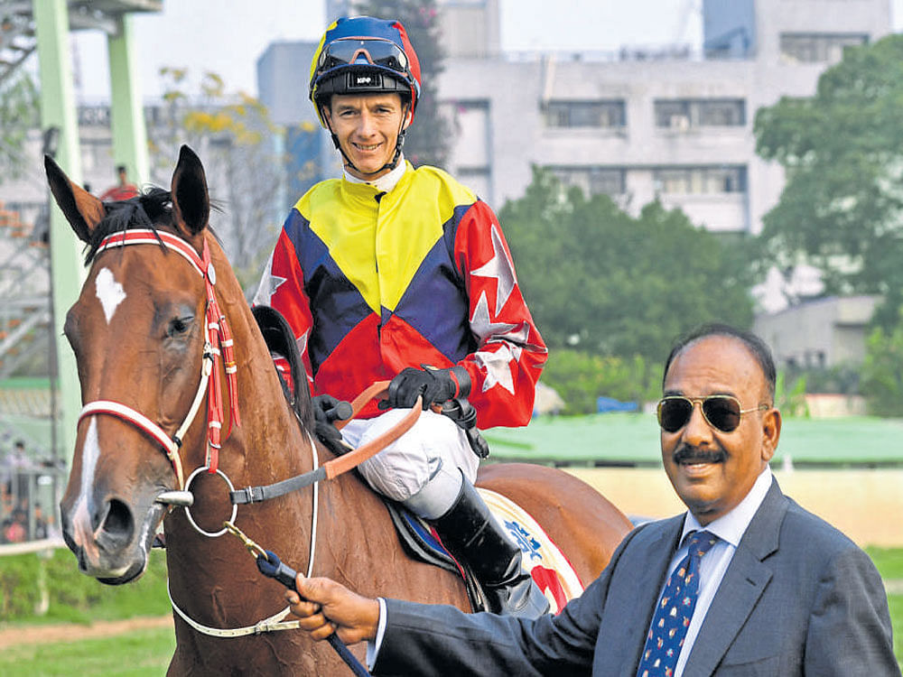 SPECIAL MOMENT Trainer S Padmanabhan leads in Ice         Glacier (David Allan), winner of the Bangalore Oaks. DH PHOTO