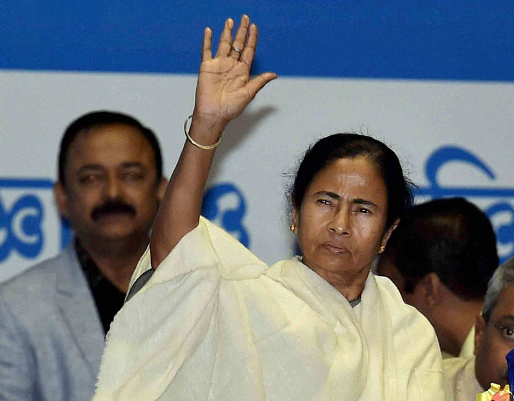 Mamata Banerjee greets teachers of different colleges and universities at a  teachers' convention in Kolkata on Saturday. PTI