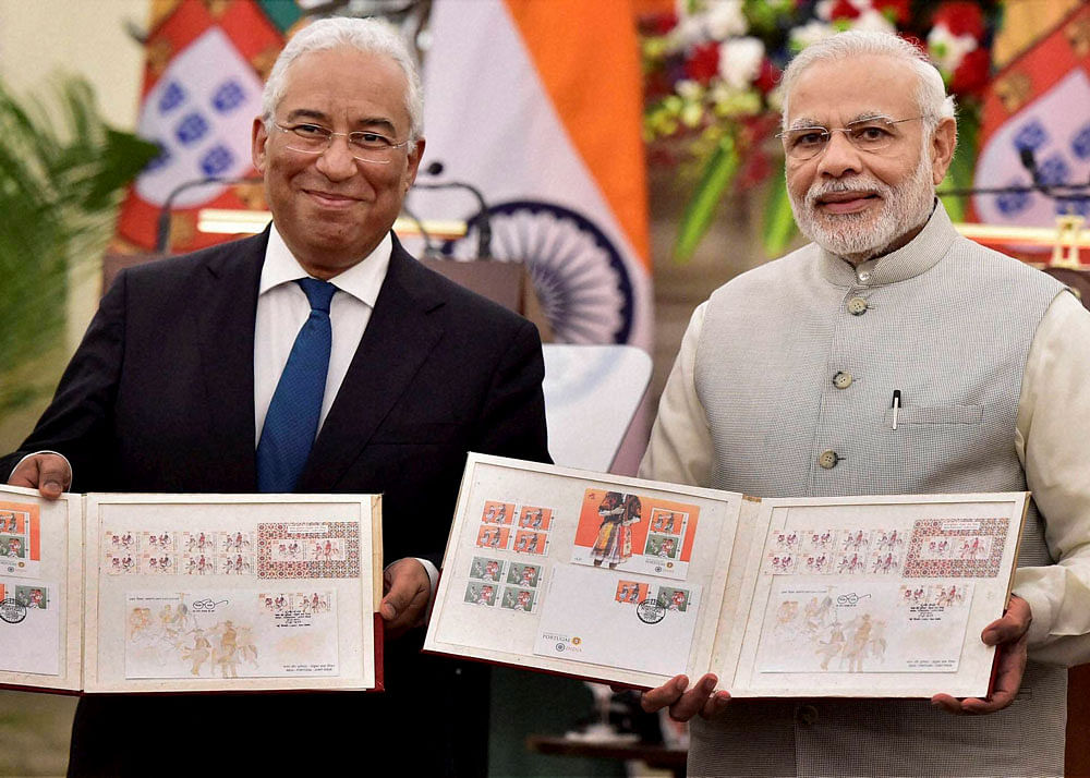Prime Minister Narendra Modi with his Portugal counterpart Antonio Costa during release stamps during 'Exchange of Agreements and Press Statements' in New Delhi on Saturday. PTI Photo