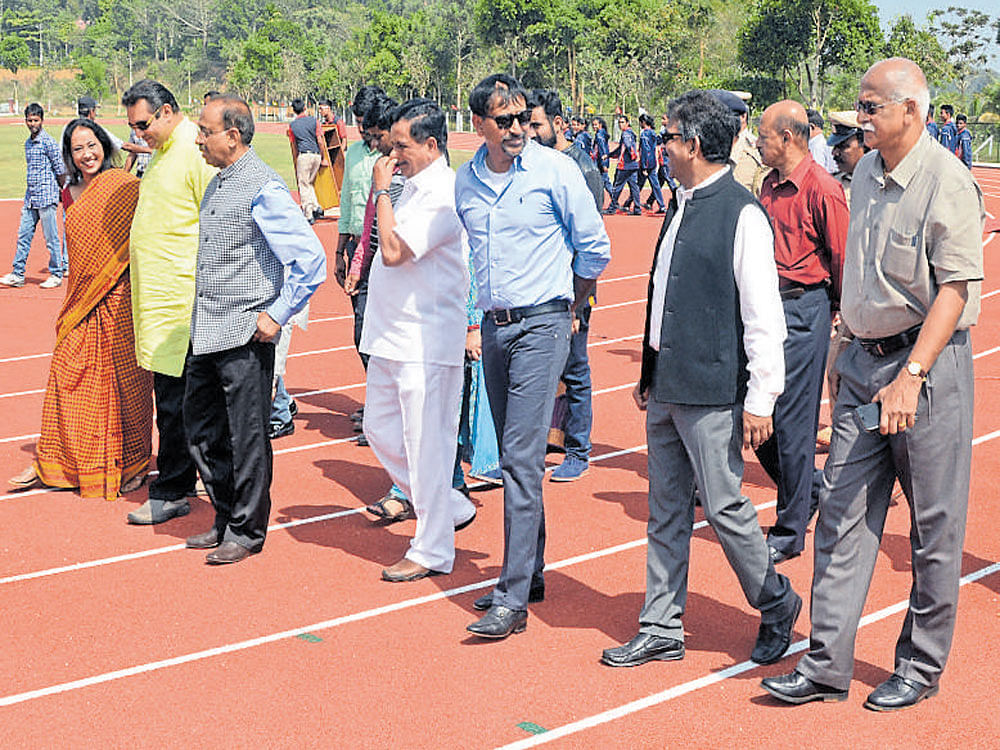 It looks good Union Sports minister Vijay Goel (third from left) along with other dignitaries inspect the newly laid  athletics track at the Ashwini Nachappa's Sports Foundation in Gonikoppal (Coorg) on&#8200;Sunday.