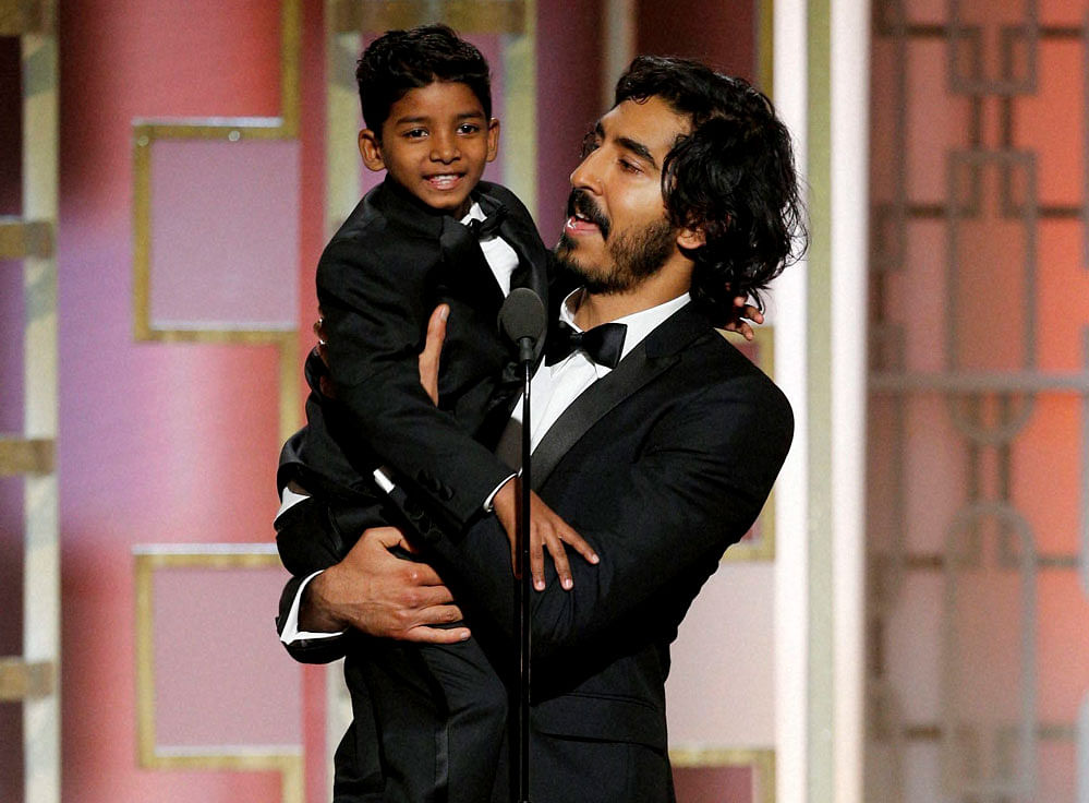 This image released by NBC shows presenters Sunny Pawar, left, and Dev Patel at the 74th Annual Golden Globe Awards at the Beverly Hilton Hotel in Beverly Hills, Calif., on Sunday, Jan. 8, 2017. AP/PTI