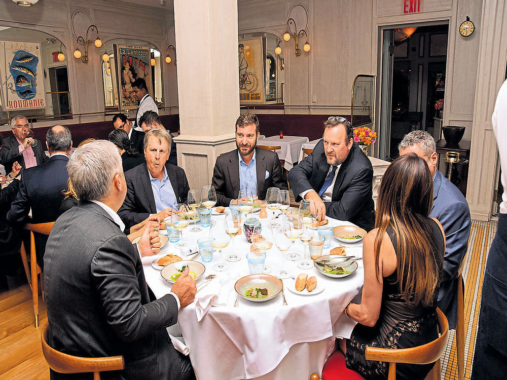 technology on plate: In a handout photo, Cellectis guests sample a dinner made with gene-edited soybeans and potatoes at Benoit New York. (inset) Gene-edited soybeans created by Calyxt that eliminate the need for hydrogenation when converted into oil. nyt