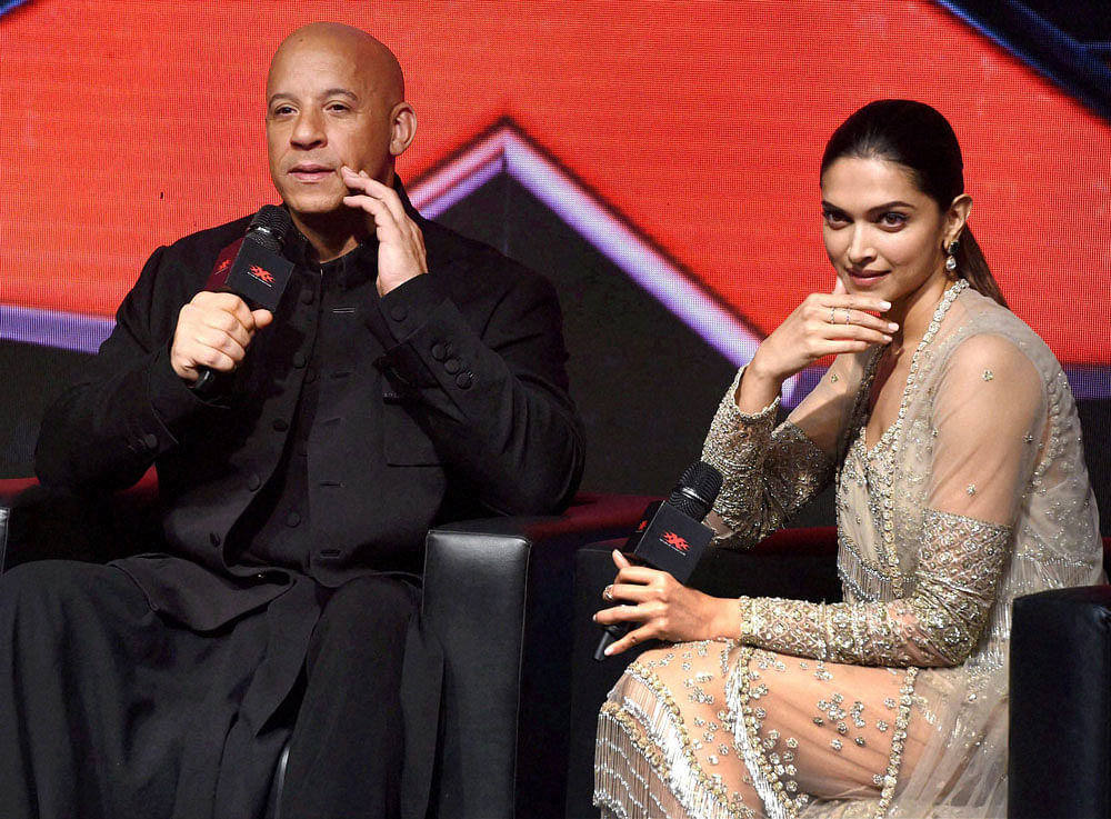 Hollywood actor Vin Diesel with actress Deepika Padukone during a press conference to promote their upcoming film 'XXX : Return of Xander Cage' in Mumbai on Thursday. PTI Photo