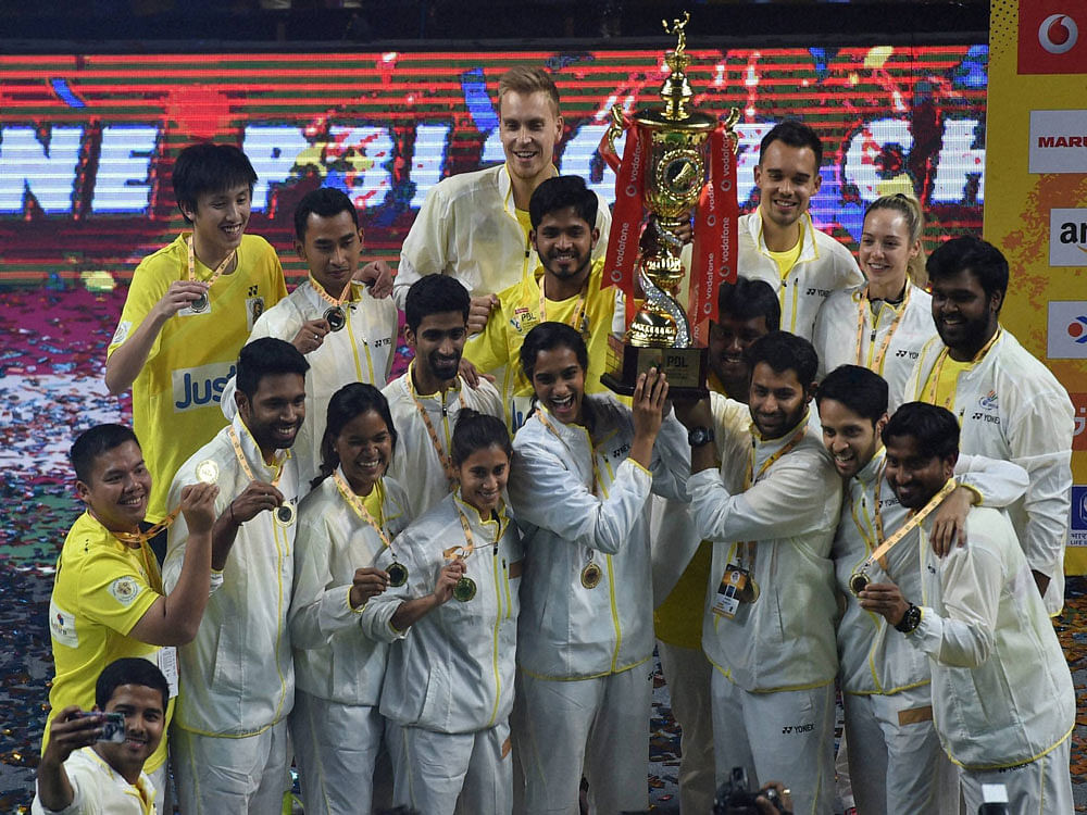Chennai Smashers celebrate with the winning trophy after beating Mumbai Rockets d at the Indian Premier Badminton League,II (2017) in New Delhi on Saturday. PTI Photo