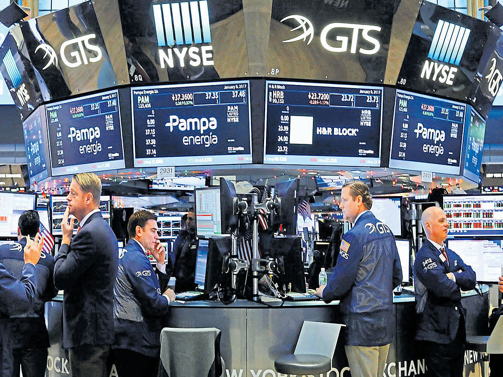 the numbers game: Traders at the New York Stock Exchange (NYSE) in New York City. International stock funds overall fell 2.8% in the quarter and rose 4.9% on the year. Some of the worst-performing stock markets were in countries on which Trump has focused. AFP