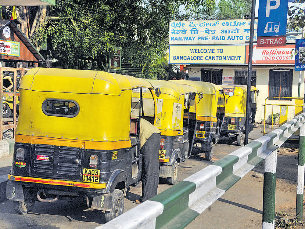 Autorickshaws wait for customers at the Bengaluru Cantonment railway station.