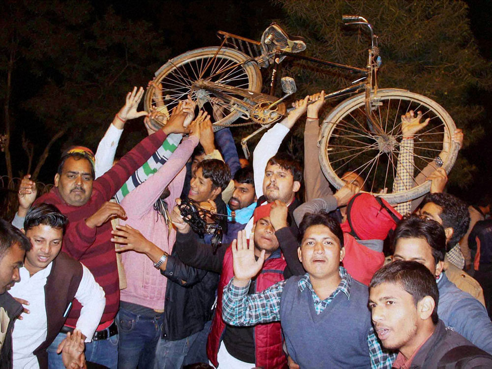 Akhilesh Yadav's supporters celebrate in Allahabad on Monday. PTI