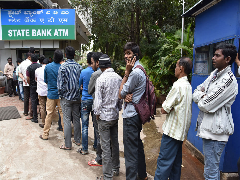 ATM withdrawal limit hiked to Rs 10k. PTI file photo
