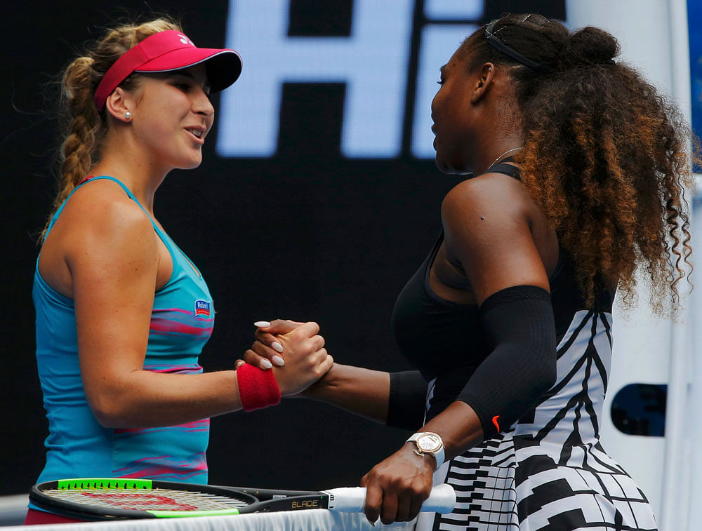 Serena Williams of the U.S. shakes hands after winning her Women's singles first round match against Switzerland's Belinda Bencic. REUTERS