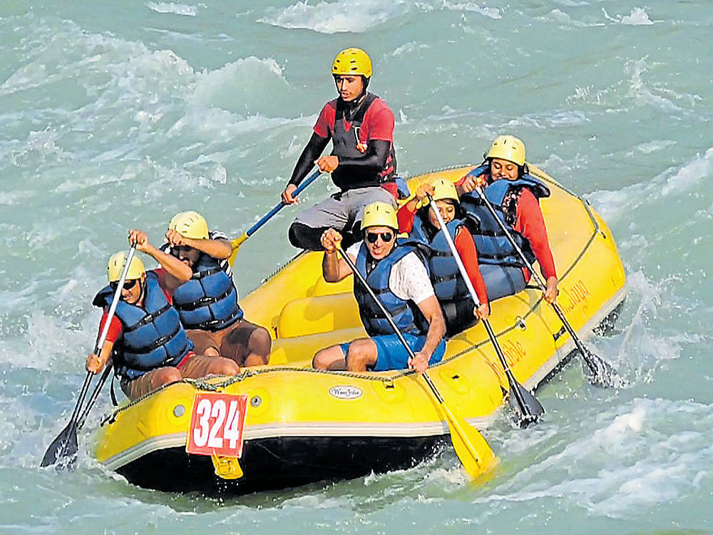 team spirit Adventure activities are becoming a popular choice to de-stress. Manoj (in white) with friends at Rishikesh.