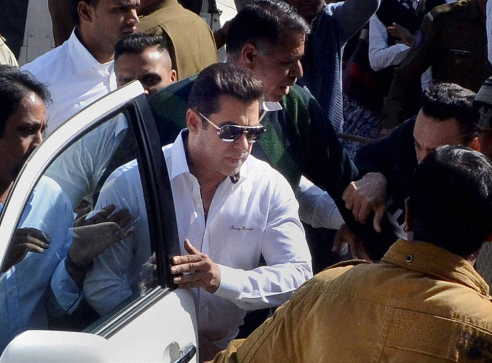Bollywood actor Salman Khan, walks through a crowd outside the court, has been acquitted in 1998 Arms Act case by Jodhpur court, in Jodhpur on Wednesday. PTI Photo