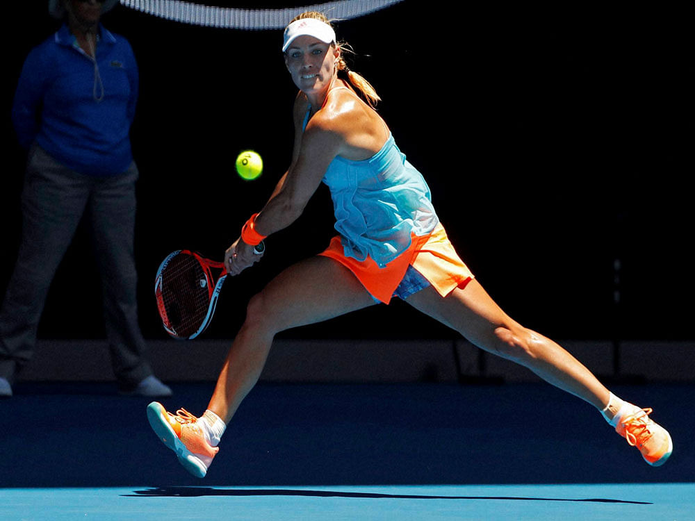 Germany's Angelique Kerber eyes on the ball for a backhand return to compatriot Carina Witthoeft during their second round match at the Australian Open tennis championships in Melbourne, Australia. AP/PTI