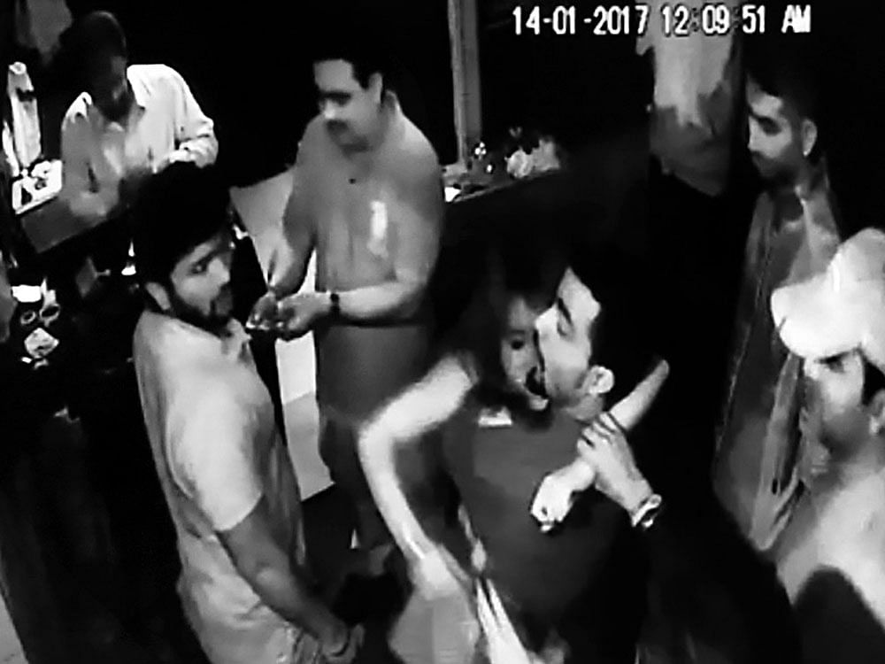 Avideo grab of the victim being manhandled outside a pub on Brigade Road on Friday night.