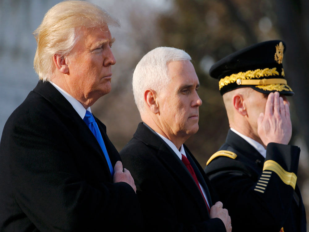 U.S. President-elect Donald Trump and Vice President-elect Pence participate in wreath laying ceremony at Arlington National Cemetery outside Washington. Reuters photo