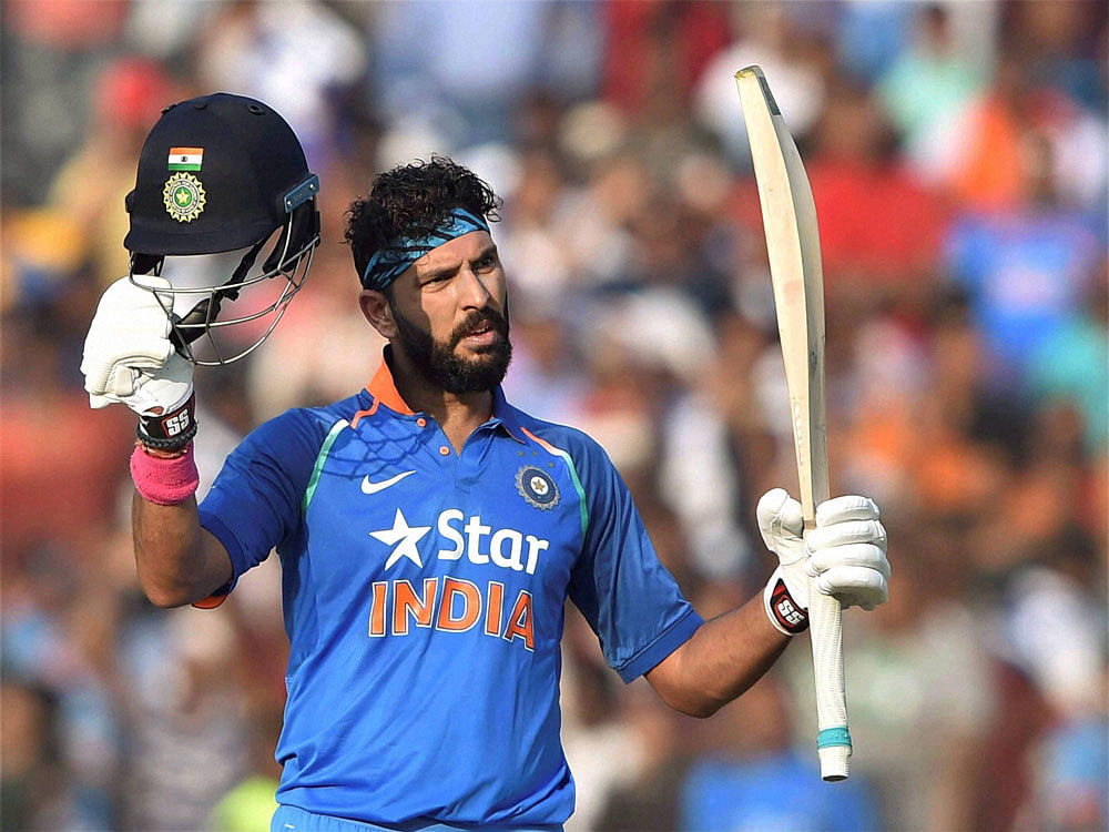 Indian batsman Yuvraj Singh acknowledging crowd after completing his century during 2nd ODI Match against England at Barabati stadium in Cuttack on Thursday. PTI Photo