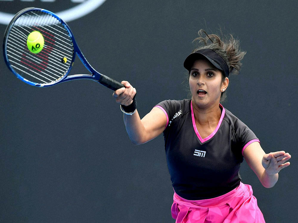 India's Sania Mirza, plays a forehand shot as she and partner Barbora Strycova play Australia's Samantha Stosur and China's Zhang Shuai in a second round women's doubles match at the Australian Open tennis championships in Melbourne, Australia, Friday, Jan. 20, 2017. AP/PTI