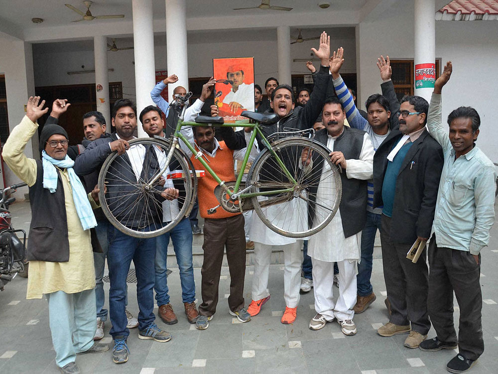 Supporters celebrate after EC's recognition of to the Akhilesh Yadav faction as the Samajwadi Party and allotting 'bicycle' symbol to it in Mirzapur on Tuesday. PTI Photo