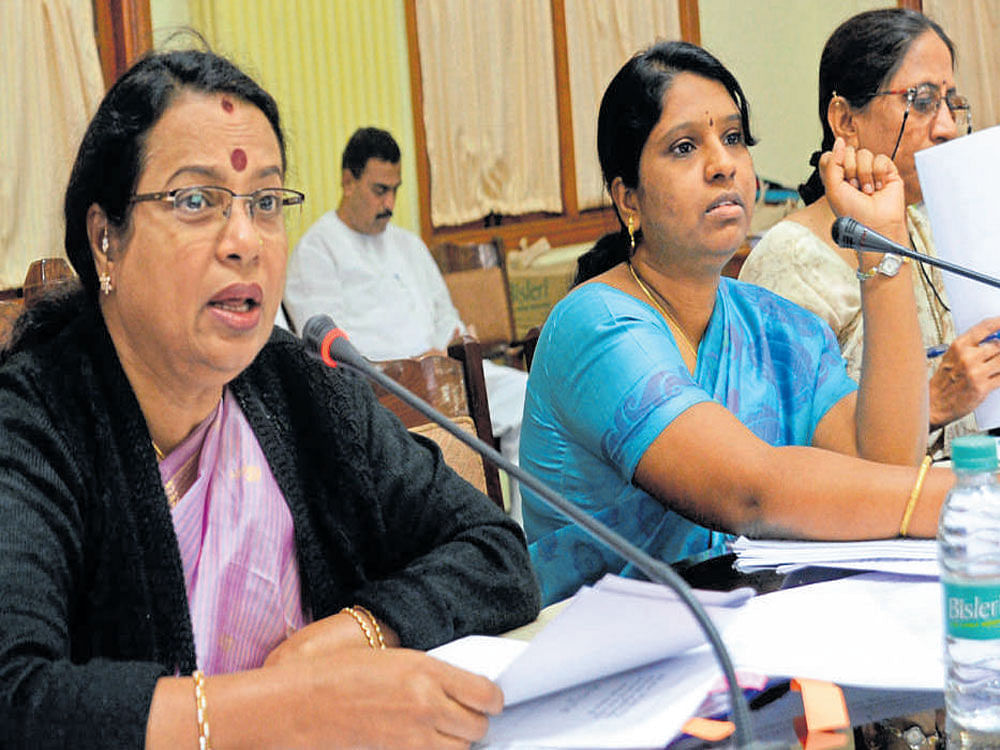 Women and Child Development Minister Umashree at a  review meeting in Bengaluru on Friday. The department's  director, Deepa Cholan, and managing director Vasundhara Devi are seen. dh photo