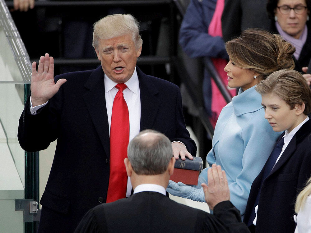 Trump takes oath; vows to set course for US, world