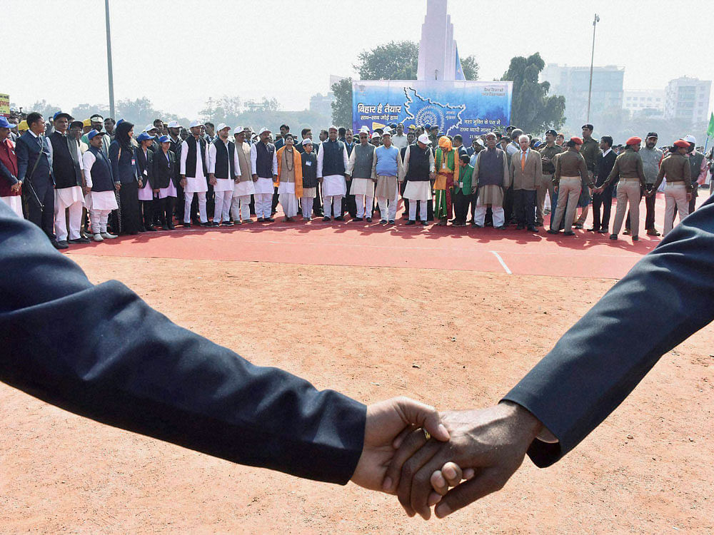 Bihar Chief Minister Nitish Kumar along with deputy CM Tejashwi Yadav,RJD Chief Lalu Prasad and his cabinet Ministers making a massive human chain against alcoholism and other addictions at historical Gandhi Maidan in Patna on Saturday. PTI photo