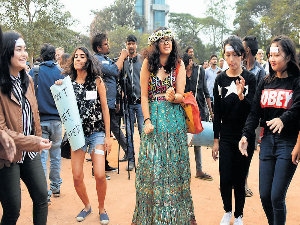 Proving a point that public spaces are meant for women, too, participants dance on the streets and at the Freedom Park as part of the #IWillGoOut march in Bengaluru on Saturday. DH&#8200;Photo