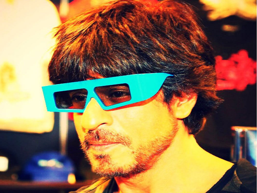 Shah Rukh had earlier shared his own picture wearing the similar pair of glasses that have been donned by AbRam. Image courtesy Twitter.