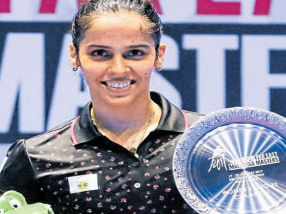 India's Sania Nehwal with her spoils on Sunday