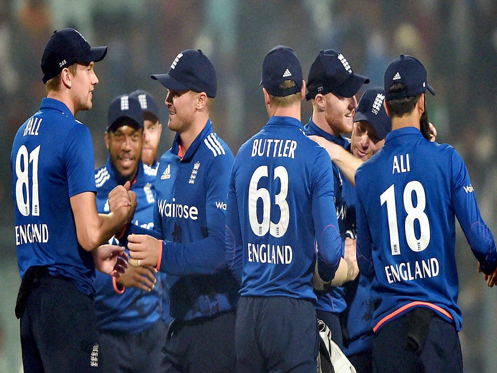 England Cricketers greets each other after they wins in 3rd ODI Match in Kolkata on Sunday. PTI Photo