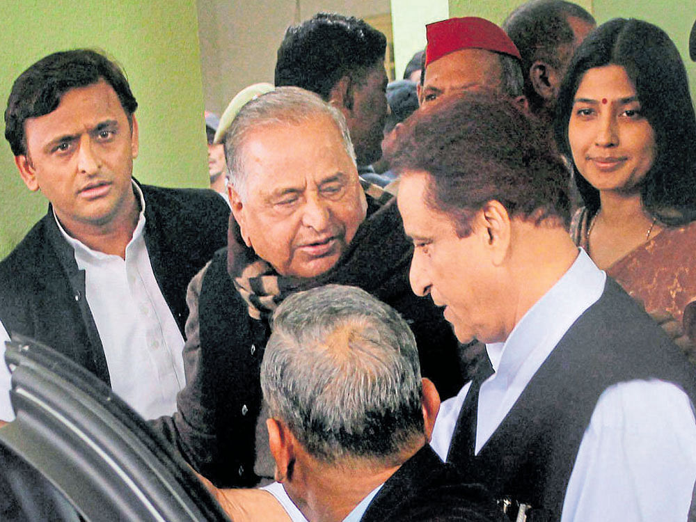 family matters: Uttar Pradesh Chief Minister and newly appointed party president Akhilesh Yadav with Mulayam Singh Yadav and Dimple Yadav at the party office in Lucknow on Sunday. PTI