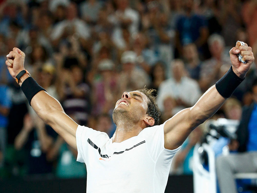 Spain's Rafael Nadal celebrates winning his Men's singles fourth round match against France's Gael Monfils. REUTERS