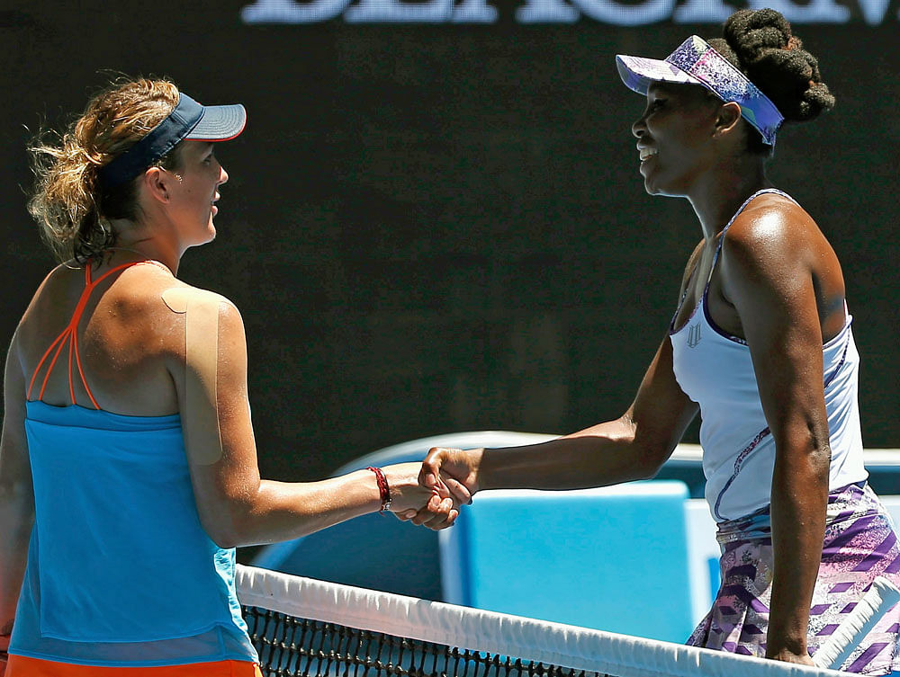 Venus Williams of the U.S. shakes hands after winning her Women's singles quarter-final match against Russia's Anastasia Pavlyuchenkova. REUTERS