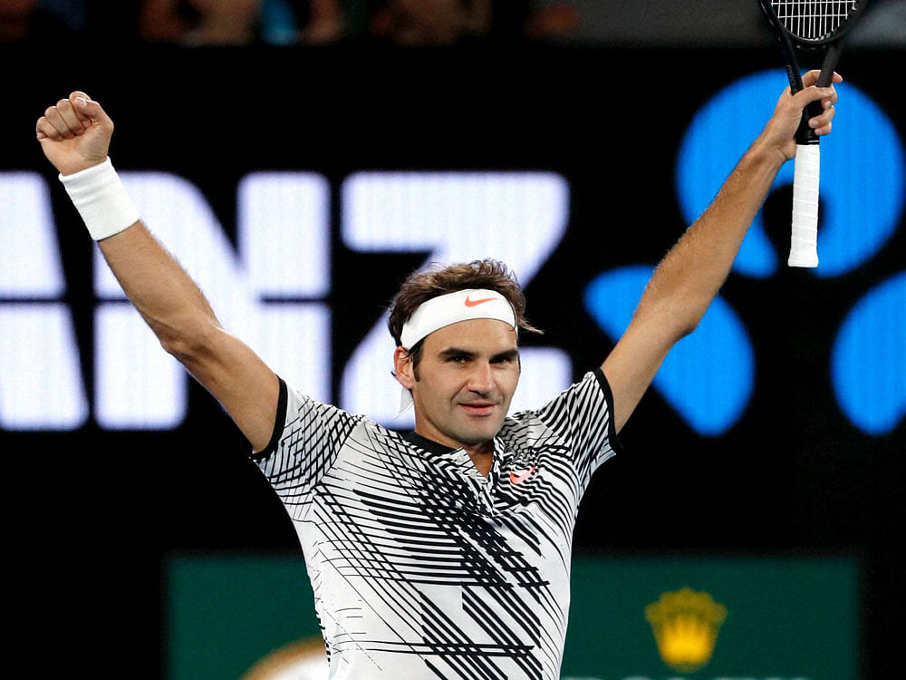 Switzerland's Roger Federer celebrates after defeating Germany's Mischa Zverev during their quarterfinal at the Australian Open tennis championships in Melbourne, Australia, Tuesday, Jan. 24, 2017. AP/PTI