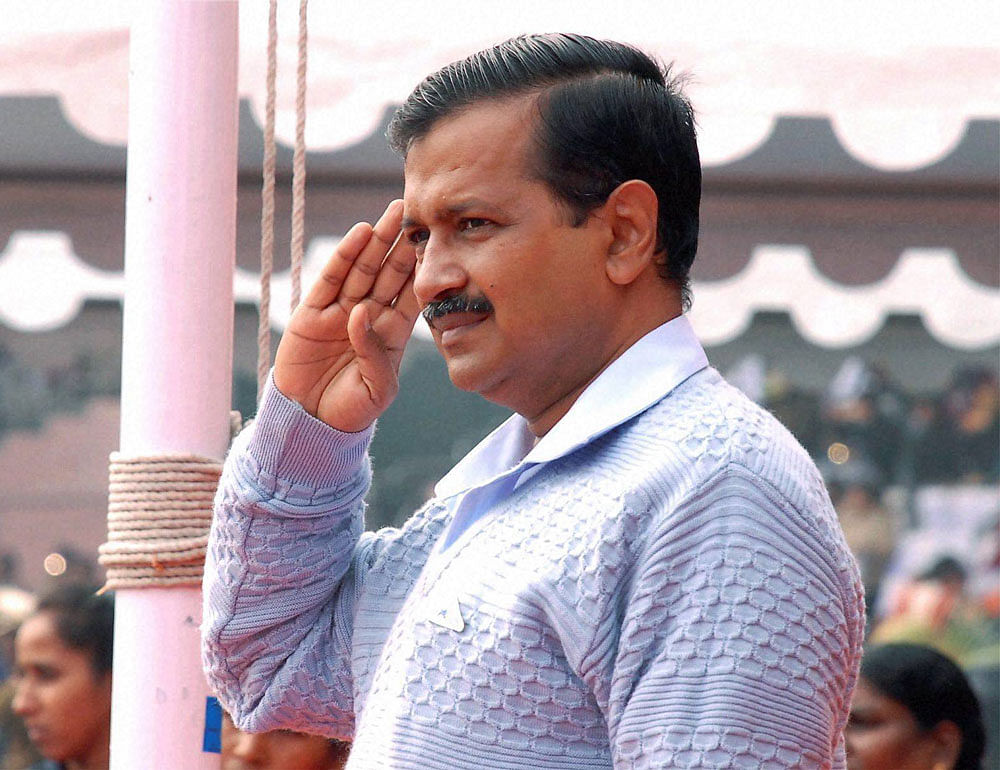 TV cameras caught a beaming Kejriwal as the Delhi Tableaux rolled past the enclosure he was in. pti file photo