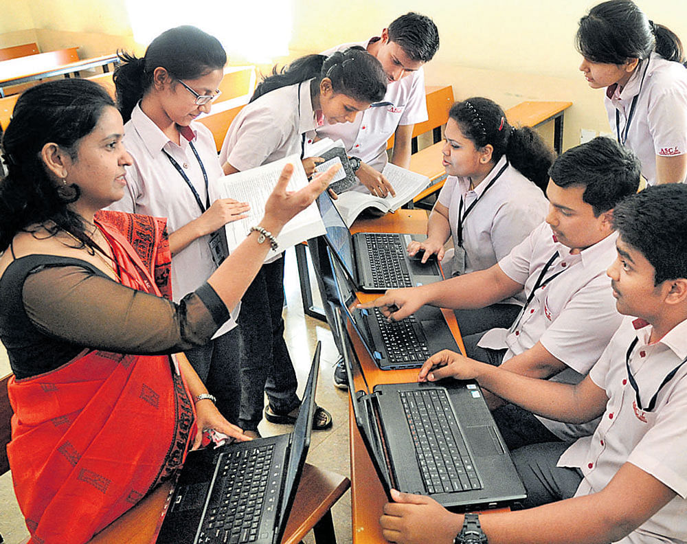 virtual world Laptops, and the more ubiquitous cellphones cut off interaction with the immediate circle around a person, even as they promote a form of communication with distant others. dh photo by srikanta sharma r