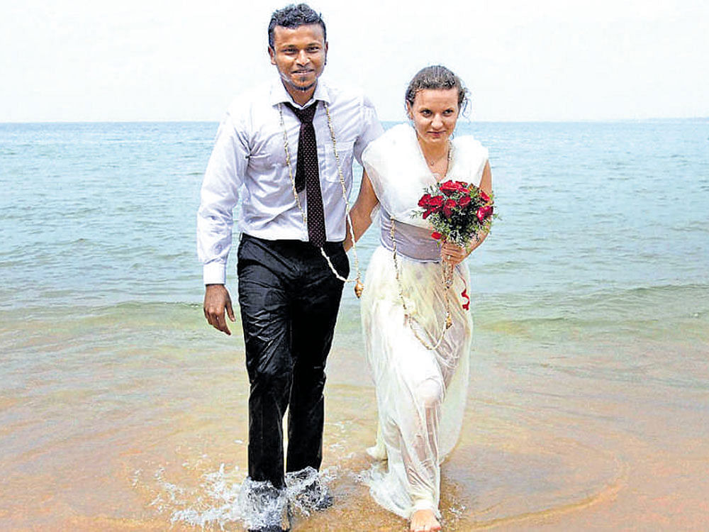 Nikhil Pawar and his Slovakian bride Eunika Pogran after  exchanging wedding vows at a beach in Kovalam,  Thiruvananthapuram, on Thursday. PTI