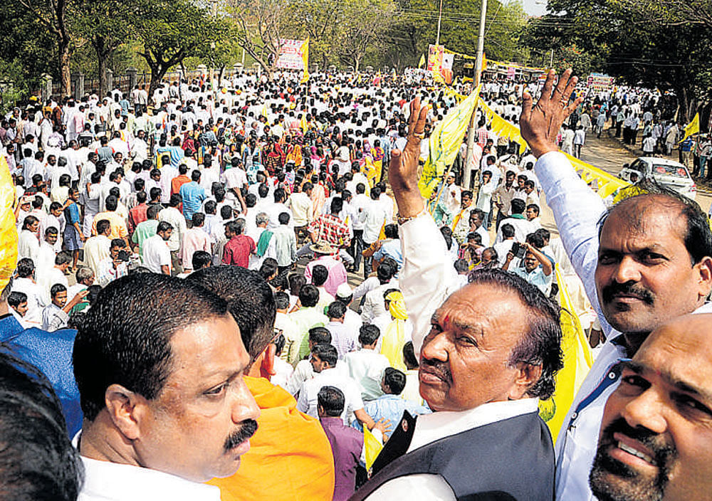 BJP leader K S&#8200;Eshwarappa waves to the crowd during a  procession ahead of a convention of the Sangolli Rayanna Brigade at Kudalasangama in Bagalkot district on Thursday.  dh photo