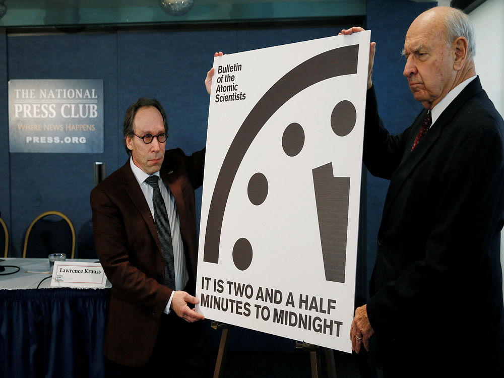 Krauss and Pickering of the Bulletin of Atomic Scientists reveal 'Doomsday Clock' adjustment during a news conference at the National Press Club in Washington. Reuters photo