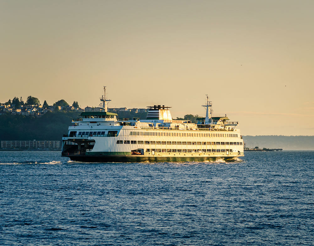 Smooth ride: A Seattle ferry leaves to Bainbridge Island at sunset.