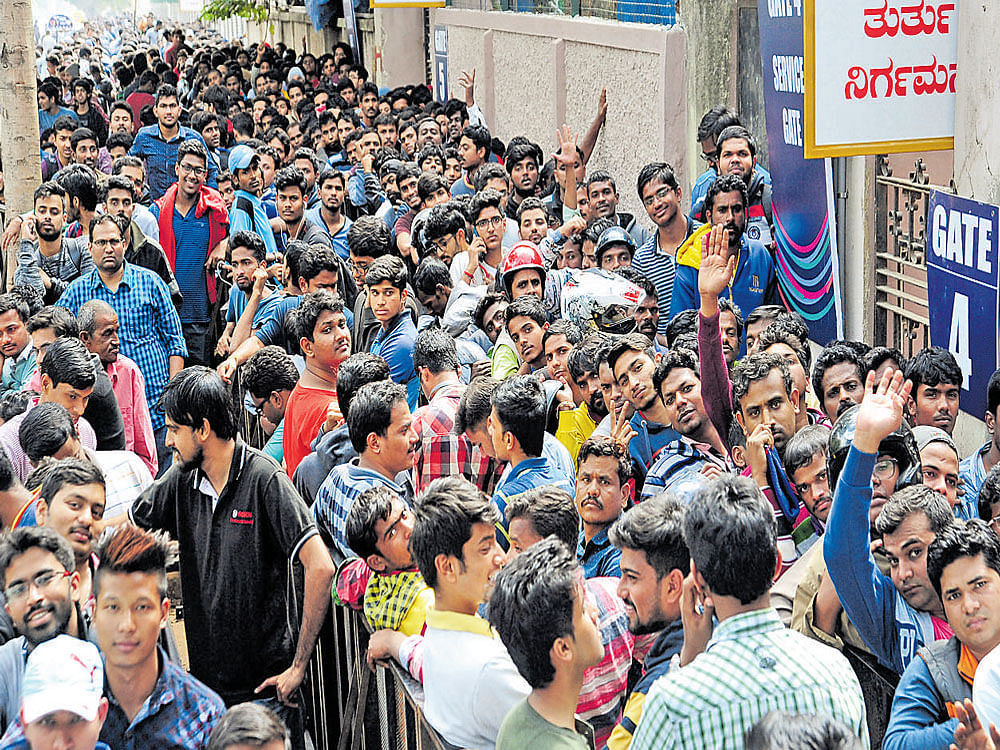 No task was more important than buying tickets for these cricket fans as they stood in queues since Friday midnight for the T20 match between India and England to be played on February 1 at the Chinnaswamy Stadium in Bengaluru. DH PHOTO