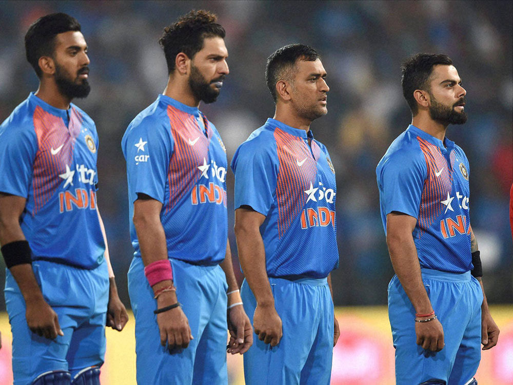 Indian cricket team players stand for the national anthem during a T20 cricket match against England in Nagpur on Sunday. PTI Photo