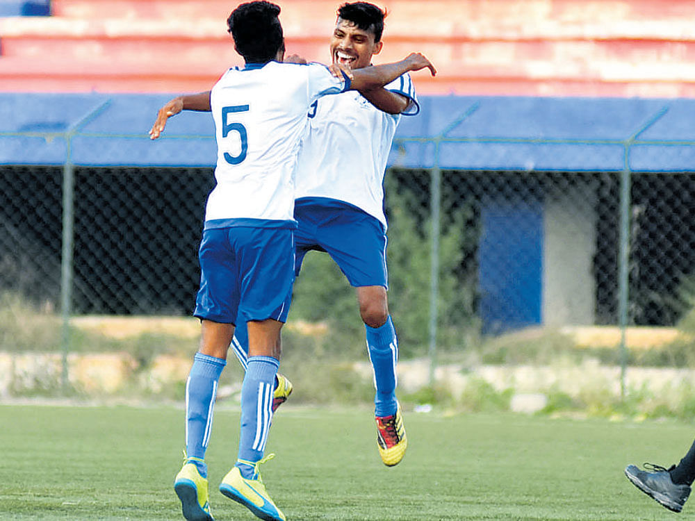 Jubilant: Student Union's Praveen KT (right)&#8200;celebrates with Akshay after scoring the winner against Ozone FC at the Bangalore Football Stadium on Tuesday. DH PHOTO