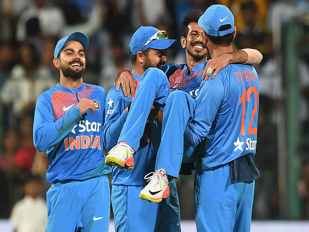 India's Yuzvendra Chahal being lifted by Suresh Raina and Yuvraj as Virat Kolhi celebrates the wicket of Englands Jorder wicket in the 3rd and final T-20 cricket match at Chinnaswamy Stadium in Bengaluru on Wednesday. DH photo