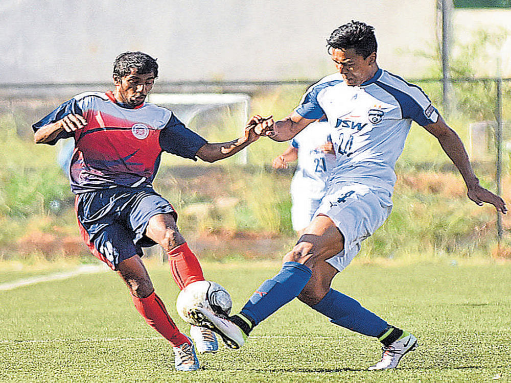keen battle: Bengaluru FC's Salam Ranjan Singh (right) and Shamnath of RWF vie for the ball. dh photo