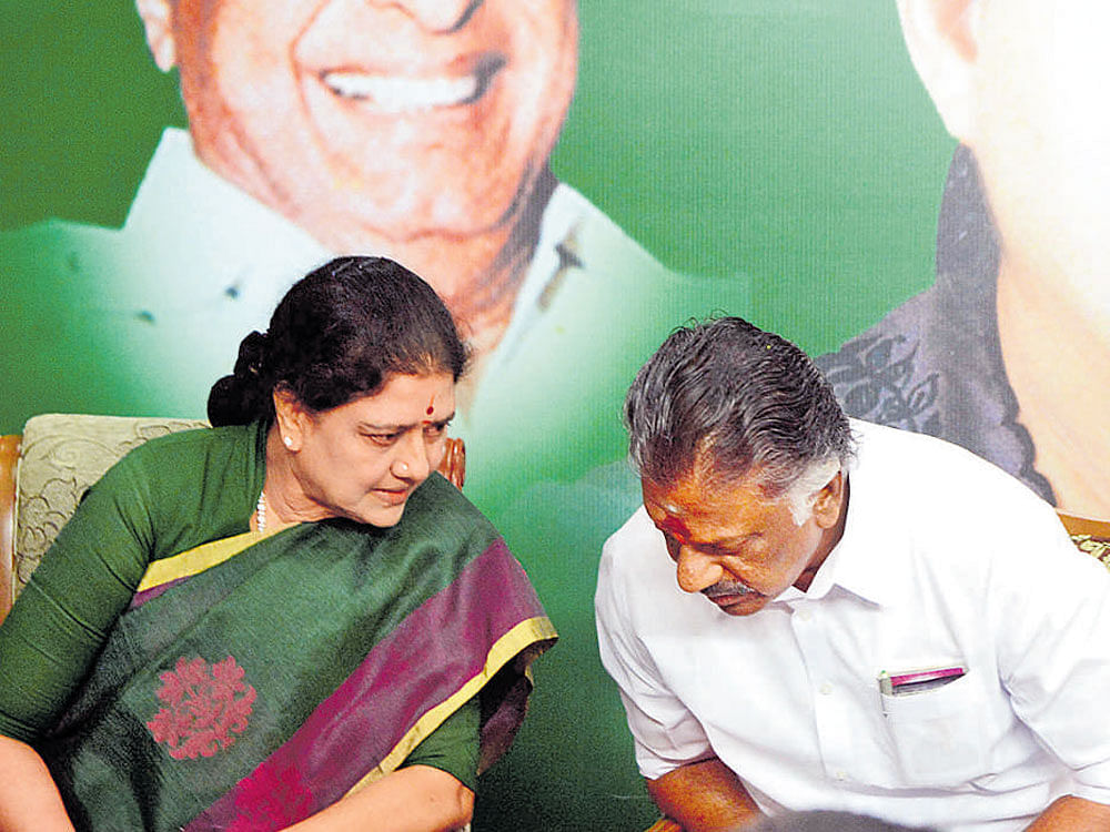Sasikala with Tamil Nadu Chief Minister Panneerselvam at party headquarters on Sunday. DH Photo